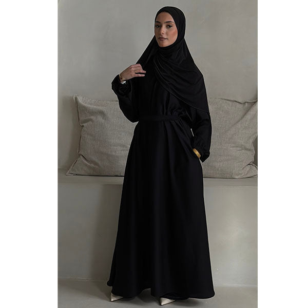 A women wearing a Black Shiny Metallic Type Satin Material Tiktok fabric A -Line Cut Abaya  with Zip Pockets and Belt Size 52 