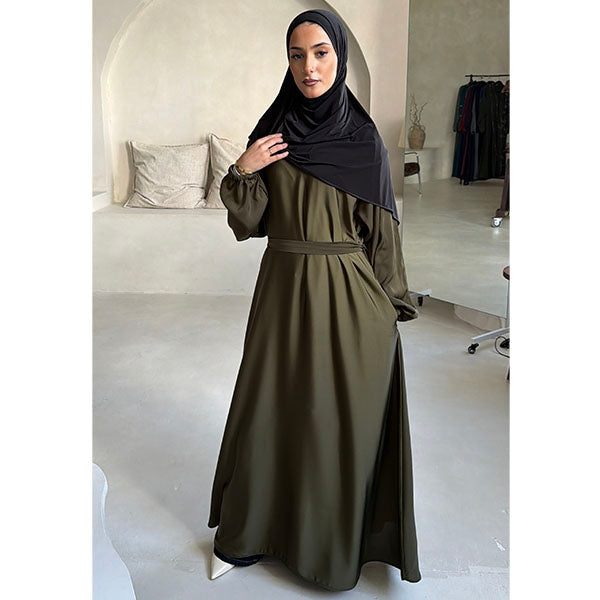 A women wearing a Khaki Shiny Metallic Type Satin Material Tiktok fabric A -Line Cut Abaya  with Zip Pockets and Belt Size 52 