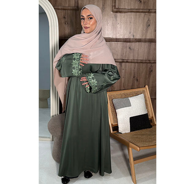 A women wearing A long Sleeve Floral Embroidered Sleeve Belted Abaya in Shiny Fabric in the colour sage green  size 52
