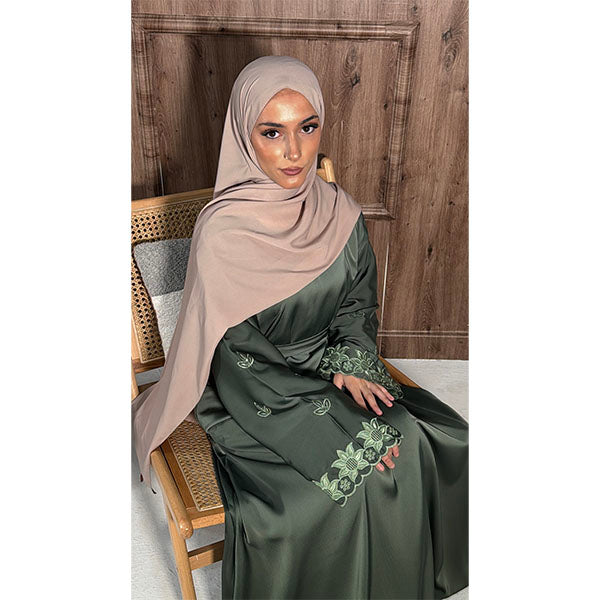 A women wearing A long Sleeve Floral Embroidered Sleeve Belted Abaya in Shiny Fabric in the colour sage green  size 52